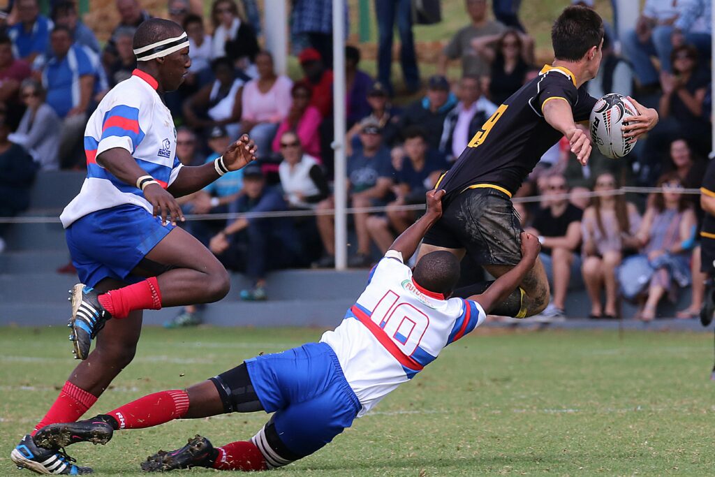 Players in a dynamic rugby match displaying teamwork and athleticism on the field.